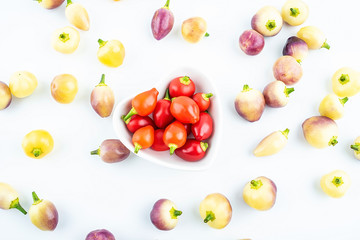 Fototapeta na wymiar Fresh colorful peppers on white background