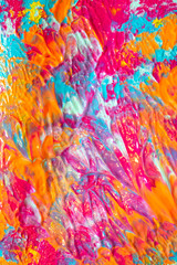 Pink Blue and Orange Paint Splatters on White Background