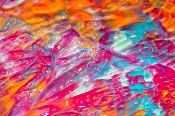 Pink Blue and Orange Paint Splatters on White Background