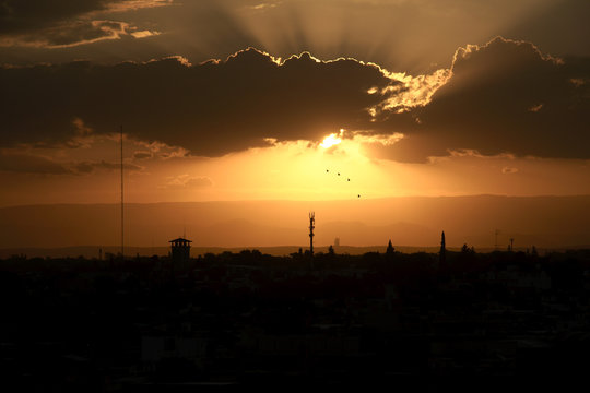 A sunset in Cordoba, Argentina, with the mountains in the background, seen from G&uuml;emes district