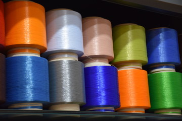 Large colorful polypropylene thread set in rainbow mood. Multicolor bobbin thread. Polypropylene multifilament yarns. Set of sewing thread coils, miscellaneous colours.