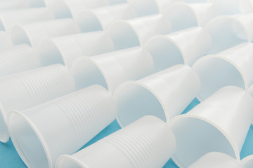 Fototapeta premium selective focus of white and plastic cups with copy space