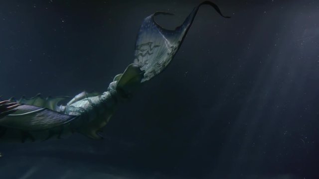 fins and flippers of tail of amazing mermaid woman, floating underwater inside ocean