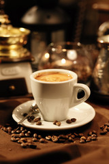 cup of coffee and beans on table