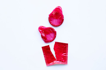 Red condom on white