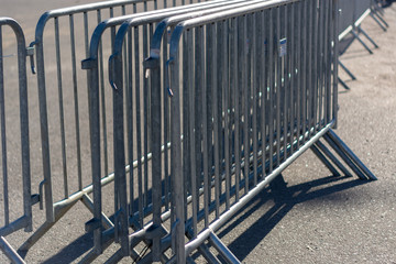 iron fence stand on the road sunny day close up