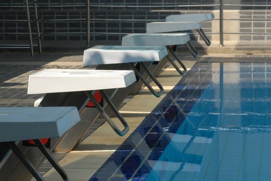 Image of swimming pool with starting blocks.