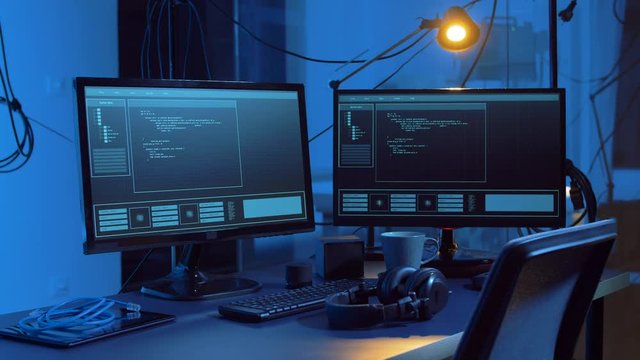 cybercrime and technology concept - hacking of computer system by virus cyber attack in dark room