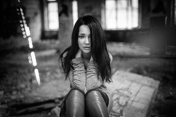 The girl suffers and cries. Portrait. Black and white