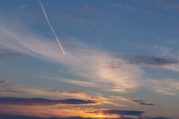 Fototapeta na wymiar clouds in the sunset spring sky