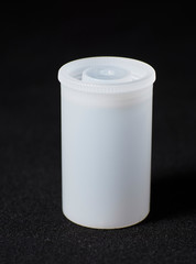 Plastic Film Canisters on dark background for 35mm film photography