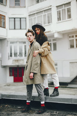 Fototapeta premium A trendy couple in a gloomy city