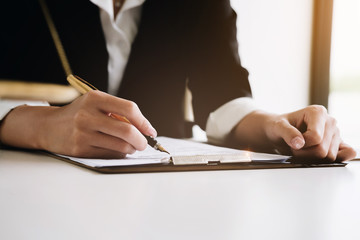 estate agent gives pen and documents agreement with customer to sign contract. Concept agreement