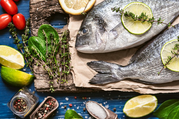 fresh raw dorado fish with spices. dinner for two with your loved one with your own hands.