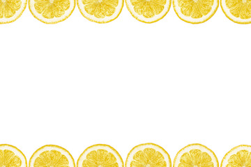 Pattern made from fresh lemon slices on a white background with copy space in the middle. Overhead...