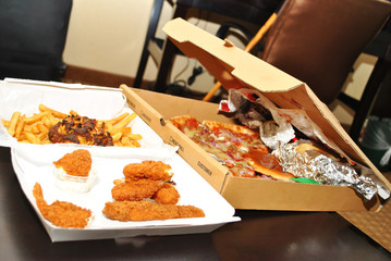 Takeout Boxes with Left Over Junk Foods 