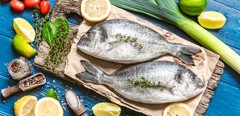 fresh raw dorado fish with spices. dinner for two with your loved one with your own hands.