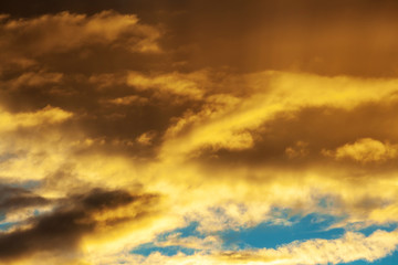 Fototapeta na wymiar Sunset sky with shades of orange. Background from dramatic cloudy sky.