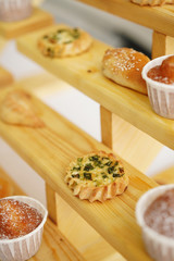 Baked pies and cakes on wooden shelves