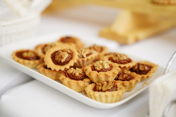 Sweets in a beautiful saucer on a white background