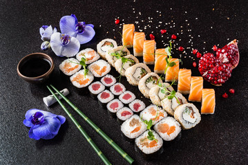 Rainbow Sushi Roll with salmon, eel, tuna, avocado, royal prawn, cream cheese Philadelphia