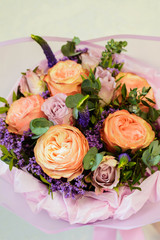 bouquet of lilac, rose, Narcissus, hyacinth, Ranunculus, Tulip, Bush rose, chrysanthemum, eucalyptus, animon, peony in a floral shop