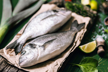 fresh raw dorado fish with spices. dinner for two with your loved one with your own hands.