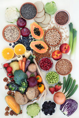High fibre health food with fresh fruit & vegetables, grains, legumes, seeds, nuts and whole grain crackers, bread rolls, also high in omega 3, anthocyanins, antioxidants & vitamins.