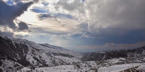 winter landscape with mountains and clouds