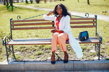 fashionable black girl in a park