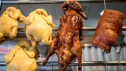 Naklejka premium Chinese traditional local food store at china. Roasted duck and pork meat