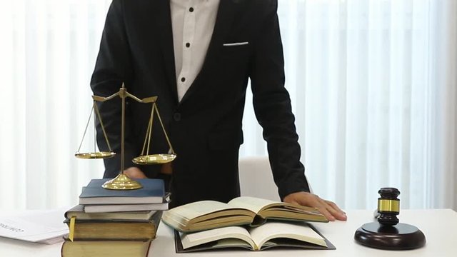 Asian lawyer prepare documents on the table in a lawyer's office.