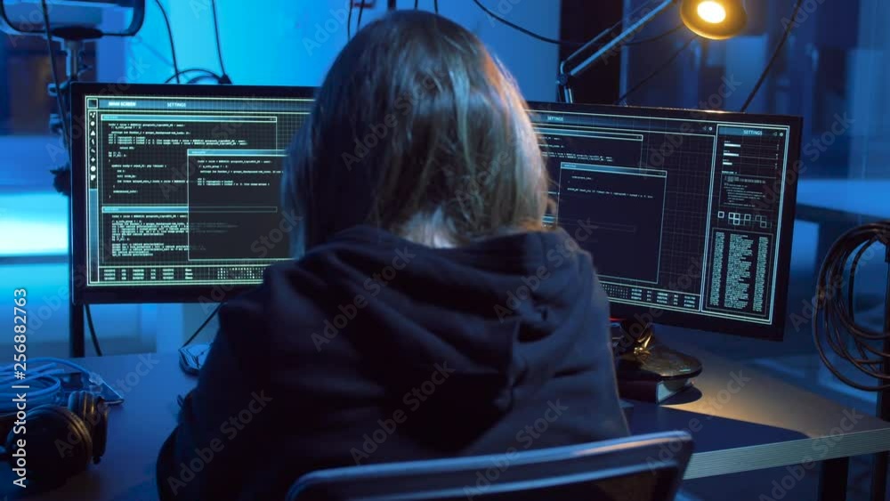 Poster cybercrime, hacking and technology concept - female hacker in dark room creating code or using compu