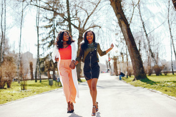 Fototapeta premium fashionable black girls in a park