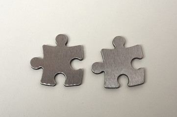 Obraz premium metal puzzle on a white background