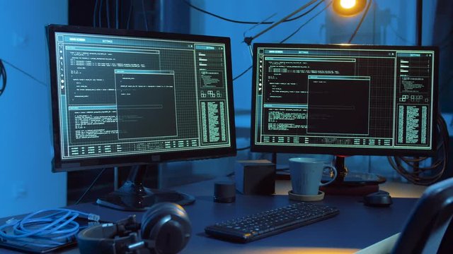 cybercrime and technology concept - hacking of computer system by virus cyber attack in dark room