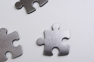 Fototapeta premium metal puzzle on a white background