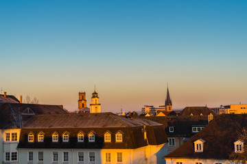 Germany, Above saarbruecken city roofs in warm sunlight