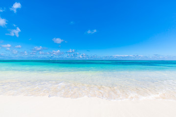 Simplicity and minimalism beach concept. White sand and blue sky, empty idyllic exotic beach landscape 