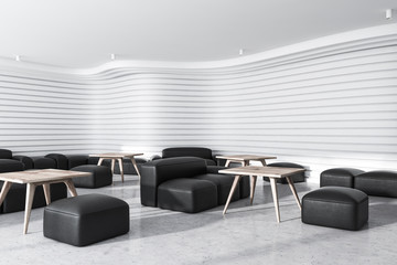 White office waiting room with black armchairs