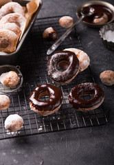 Homemade donuts with sugar and cinnamon on a wooden background. Rustic style.