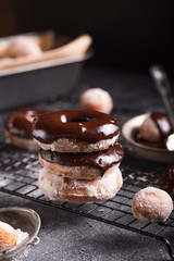 Homemade donuts with sugar and cinnamon on a wooden background. Rustic style.