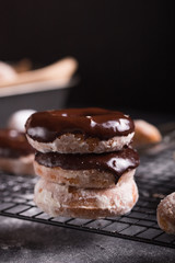 Homemade donuts with sugar and cinnamon on a wooden background. Rustic style.
