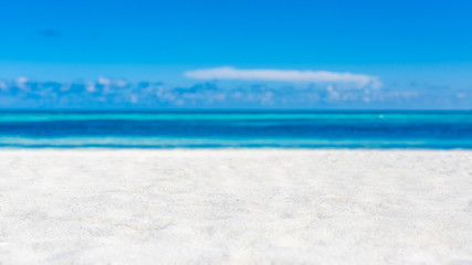 Fototapeta na wymiar Empty tropical beach scene, white sand blue sky and blue sea view. Minimal beach background concept