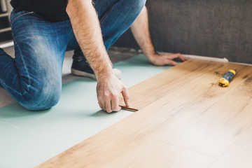 Flooring technology - laying of a floating laminate floor - eco-friendly finishing material