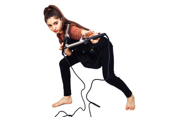 Obraz premium young girl hairdresser with curling iron.