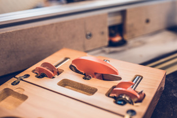 Carpentry workshop - a large selection of different nozzles for the machine