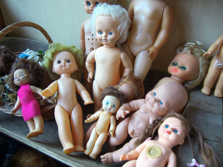 Many saty plastic Soviet dolls are a group