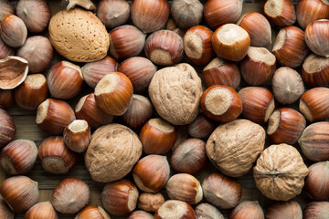 Scattered nut on table top view. Nut assortment flat lay. Nut texture. Nut package