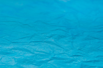 Obraz premium blue creased tissue papet background texture selective focus macro